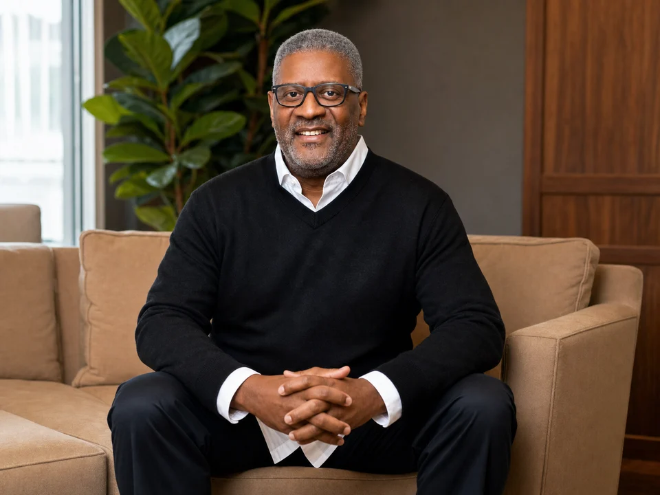 Andre Leftwich seated in a relaxed interview portrait
